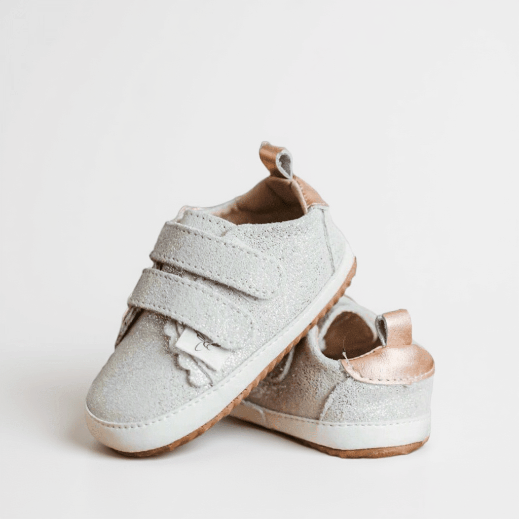 Leather barefoot children's shoe with a wide toe box and double Velcro closure straps.