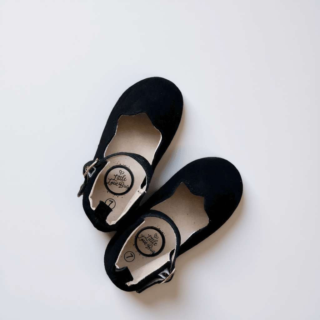 Baby wearing Little Love Bug Co. The Olivia organic baby moccasins