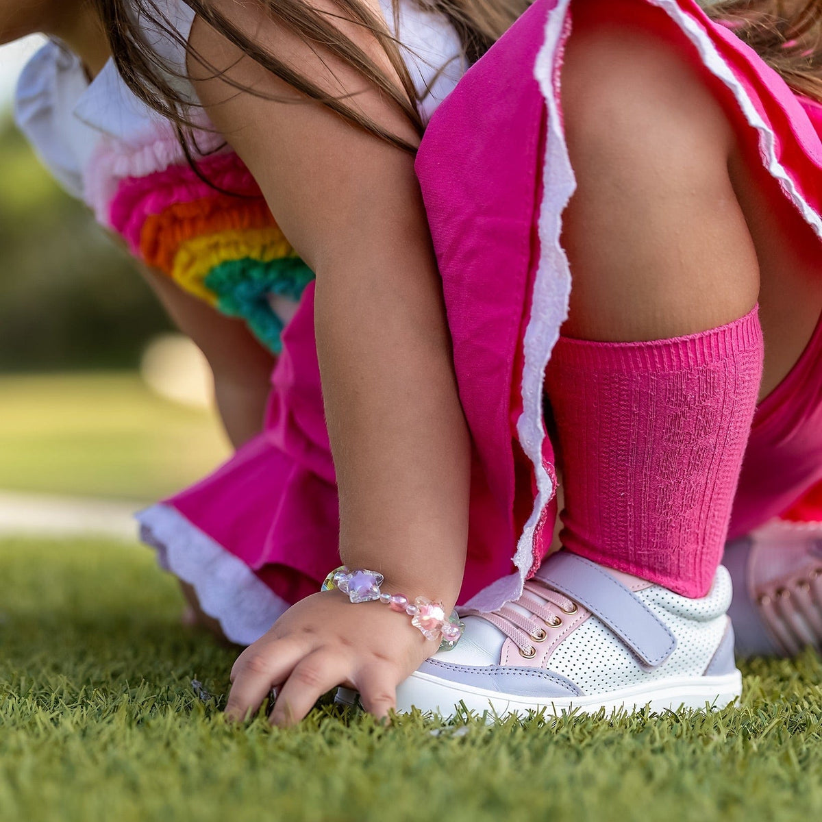 Leather low top baby shoes with rubber-capped toe and non-slip sole, shown as a pair