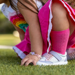 Leather low top baby shoes with rubber-capped toe and non-slip sole, shown as a pair