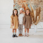 Little Love Bug Co. Reagan soft sole leather baby moccasins in blush pink.