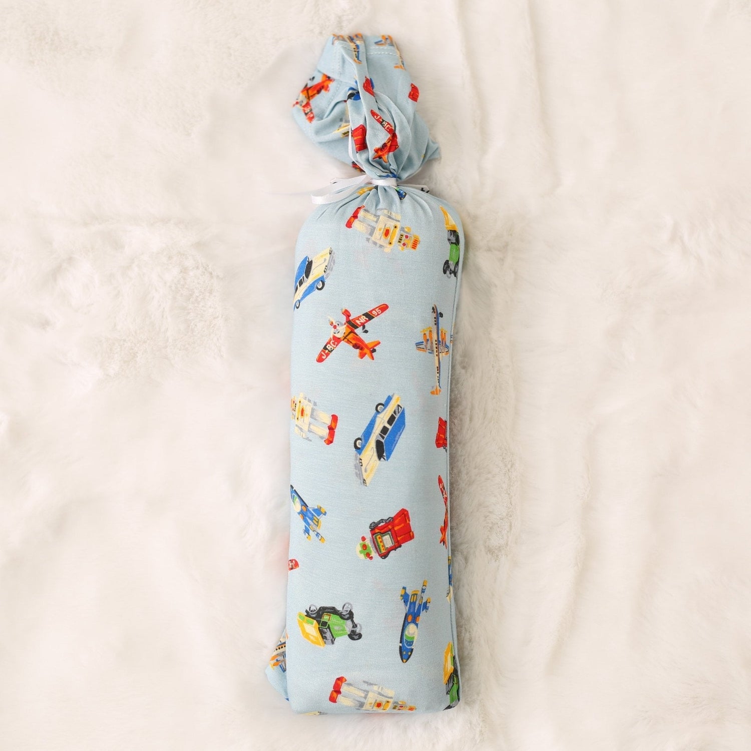 Swaddle blanket with a tiny travelers print, shown spread flat as a large square wrap