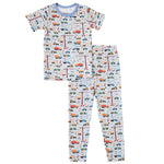Short sleeve baby pajama set with a construction site print featuring trucks on the top and pants.