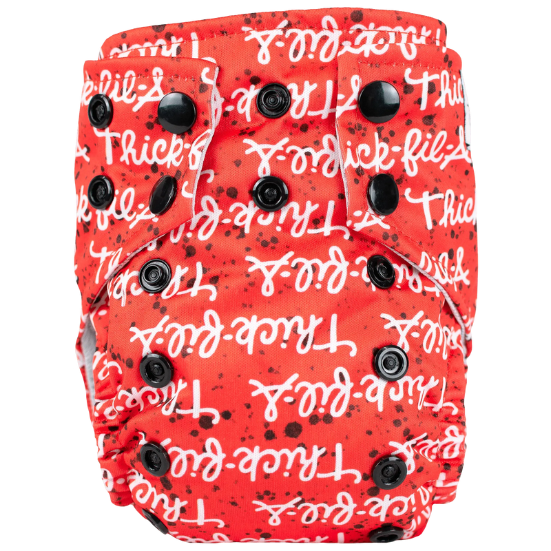 Tiny Tushies Newborn AIO Cloth Diaper with red and white design and black snaps.