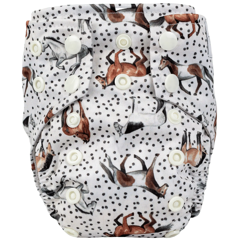Tiny Tushies Newborn AIO cloth diaper with horse print and multiple snaps for adjustable fit.