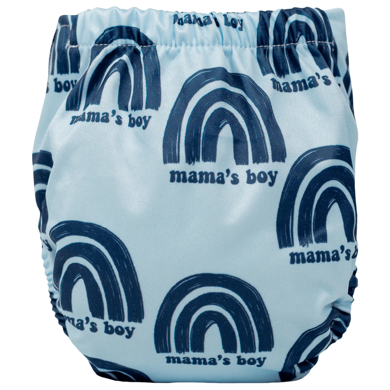 Tiny Tushies Newborn AIO Cloth Diaper with blue rainbow print, secure snaps, and adjustable fit.