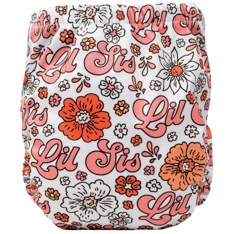 Tiny Tushies Newborn AIO Cloth Diaper with floral Lil Sis design.