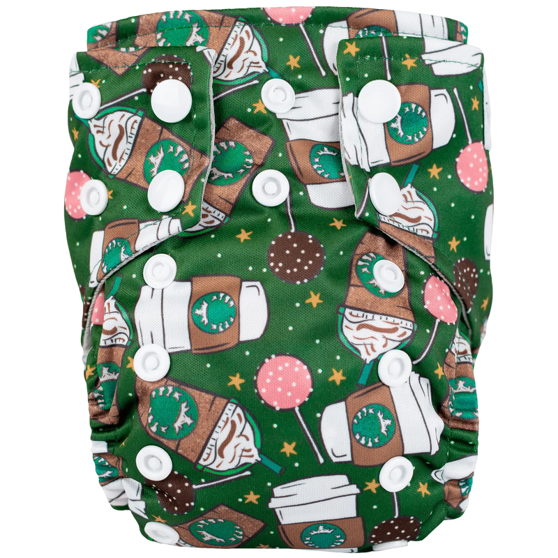 Tiny Tushies Newborn AIO Cloth Diaper with pocket opening, featuring colorful coffee-themed design and adjustable snaps.