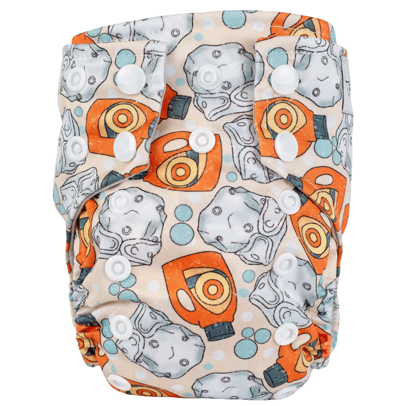 Tiny Tushies Newborn AIO Cloth Diaper with colorful print and secure snaps.