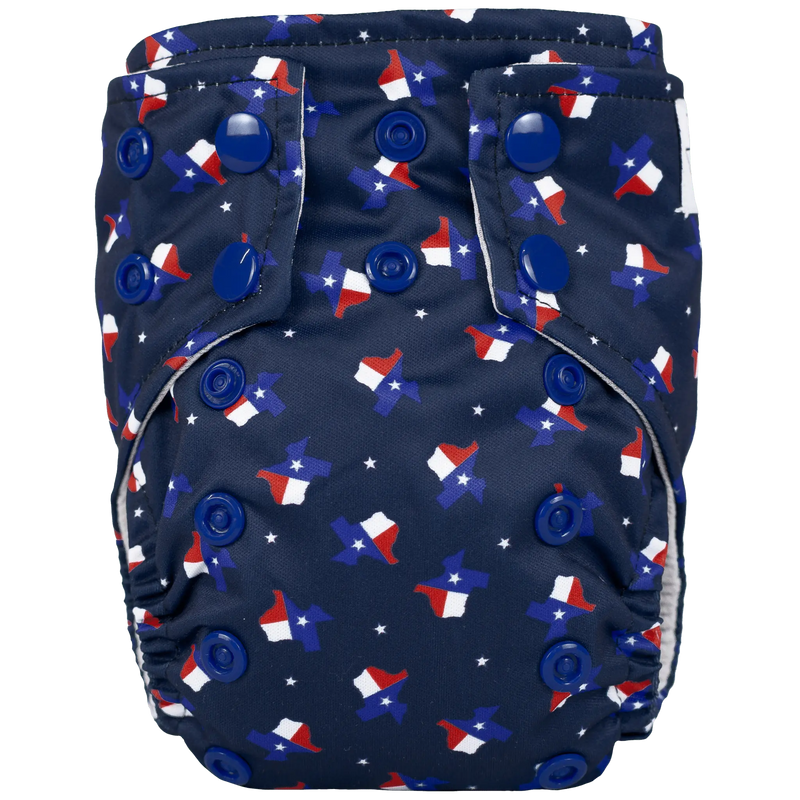 Tiny Tushies Newborn AIO cloth diaper with Texas-themed design and secure snaps.