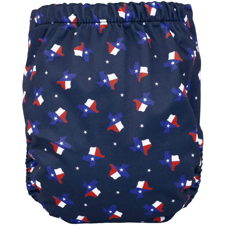 Tiny Tushies Newborn AIO Cloth Diaper with Texas print, secure snaps, and pocket opening for inserts.