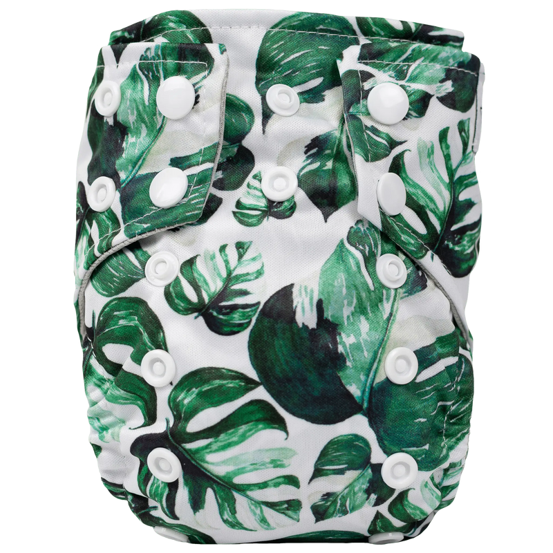 Tiny Tushies Newborn AIO Cloth Diaper with green leaf print and white snaps.
