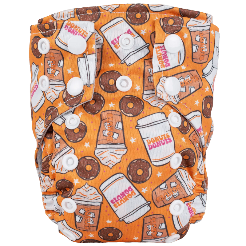 Tiny Tushies Newborn AIO Cloth Diaper with donut print design and secure snaps.