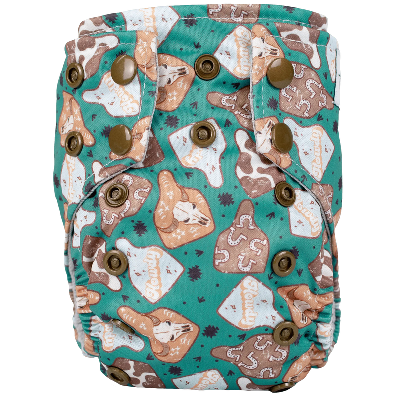 Tiny Tushies Newborn AIO Cloth Diaper with colorful print and secure snaps.