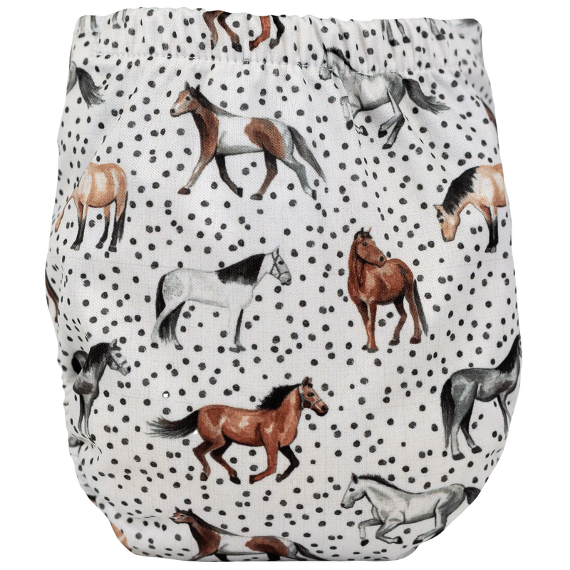 Tiny Tushies Newborn AIO Cloth Diaper with horse print design.