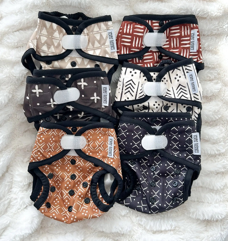 Tiny Tushies Newborn Cover with hook and loop, various patterns, suitable for 5-20 lbs babies.