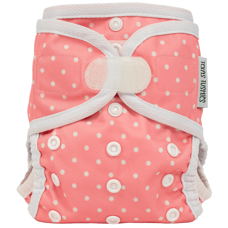 Tiny Tushies Newborn Cover with hook and loop design for adjustable fit.