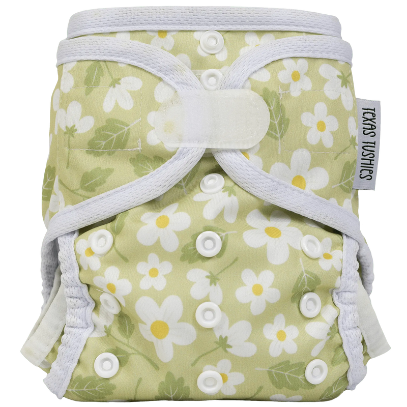 Tiny Tushies Newborn Hook & Loop Cover with flower print design.