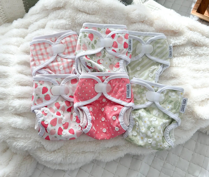 Tiny Tushies Newborn Cover with adjustable hook and loop closures and cute printed patterns for babies 5-20 lbs.