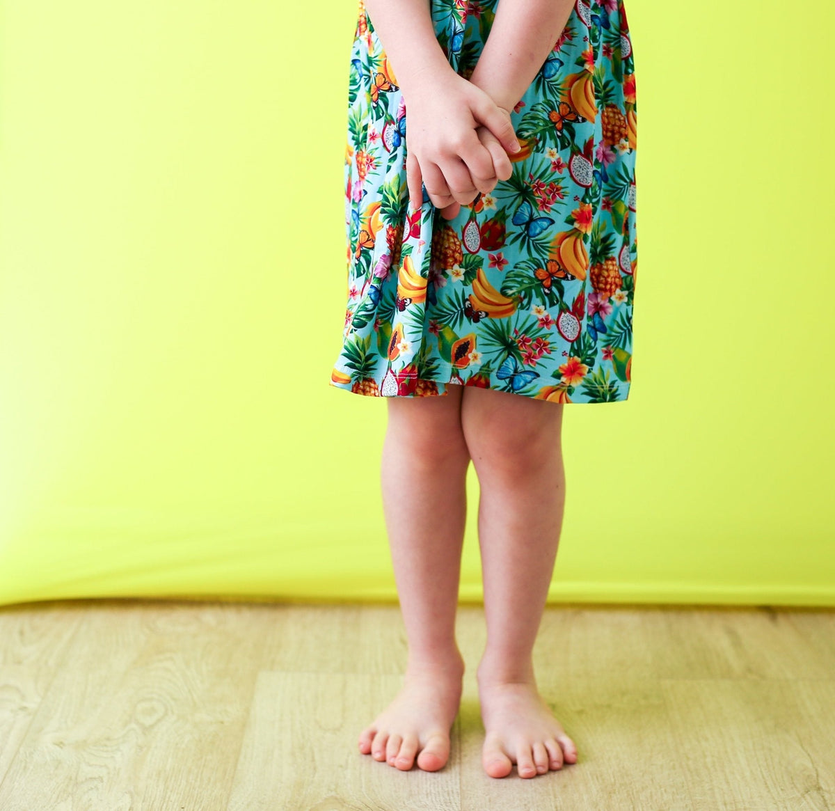 Tropical fruit print racer-back dress with long sleeves and a full twirl skirt