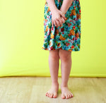 Tropical fruit print racer-back dress with long sleeves and a full twirl skirt