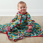 Baby footie pajamas with a colorful tropical fruit print, two-way zipper, and covered feet.