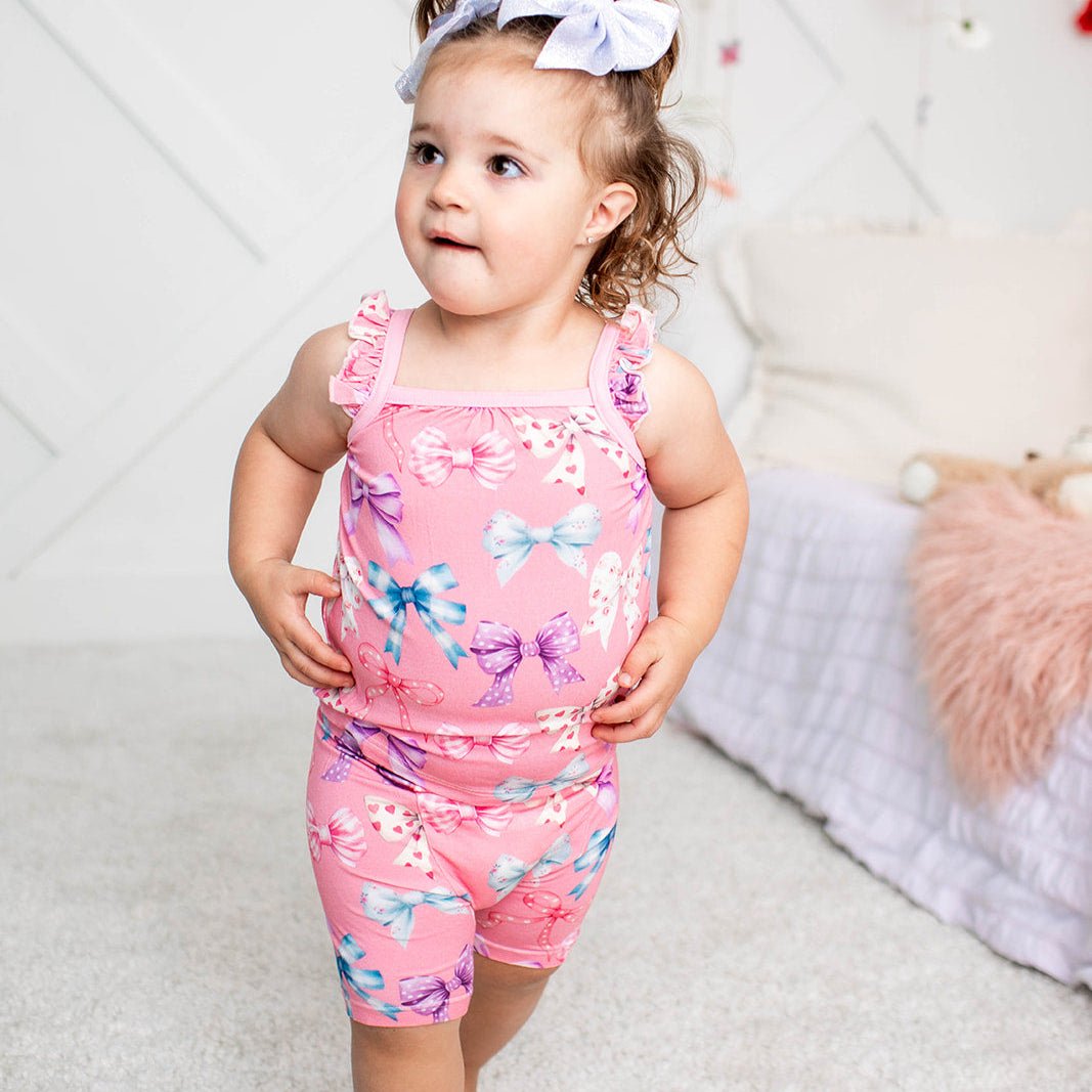 Baby two-piece set with flutter-sleeve tank and shorts in a white bow print