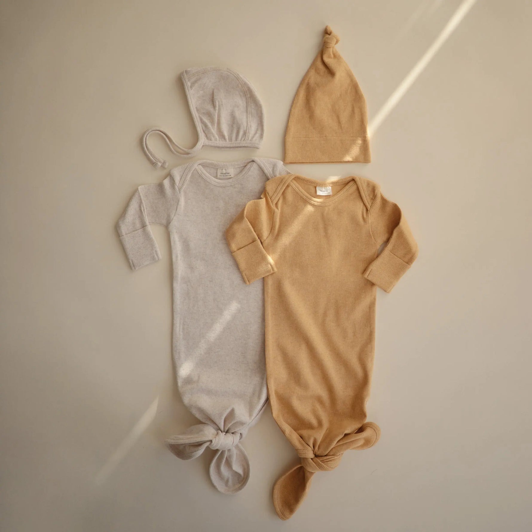 Mushie Ribbed Organic Cotton Baby Beanie for Newborns 0-3 Months with Top Knot Design - Apparel & Accessories > Clothing > Baby & Toddler Clothing > Baby & Toddler Outfits Baby Clothes