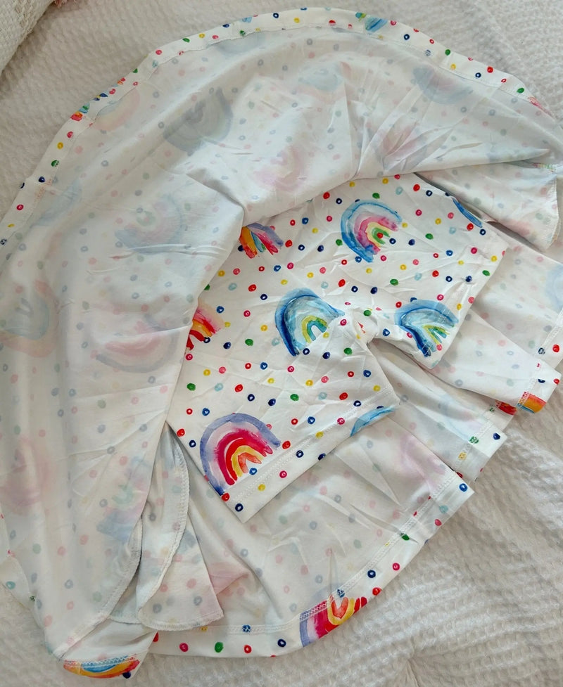 Soft, stretchy Twirl Skorts with rainbow pattern, combining skirt style with shorts practicality.