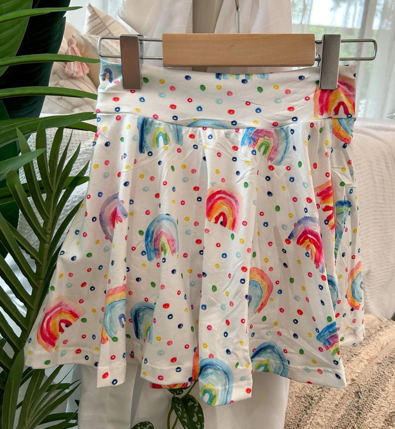 Twirl Skorts with rainbow dot pattern, soft polyester, combining skirt and shorts for comfort and style.