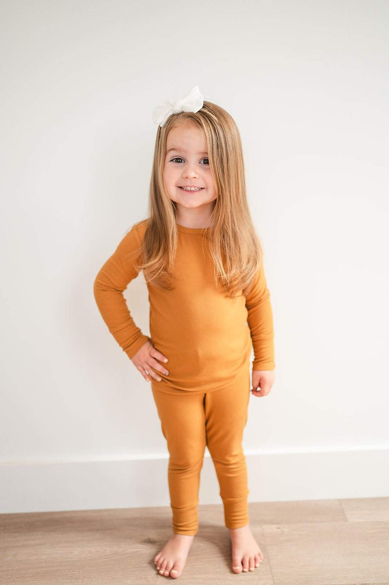 Caramel ribbed two-piece pajama set for kids made from bamboo fabric.