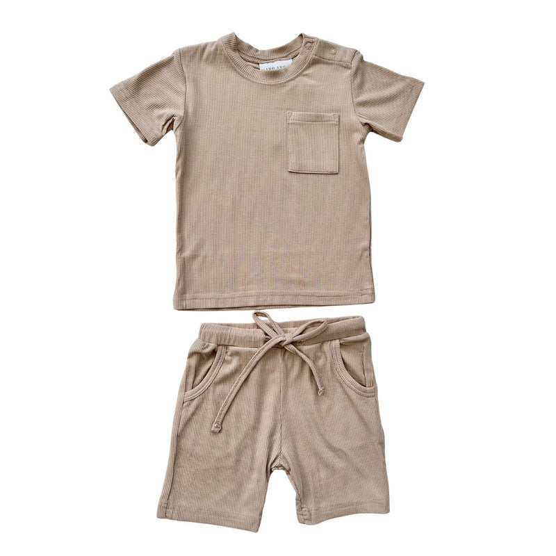 Tan two-piece ribbed short set with pocket shirt and drawstring shorts, made of bamboo and spandex.