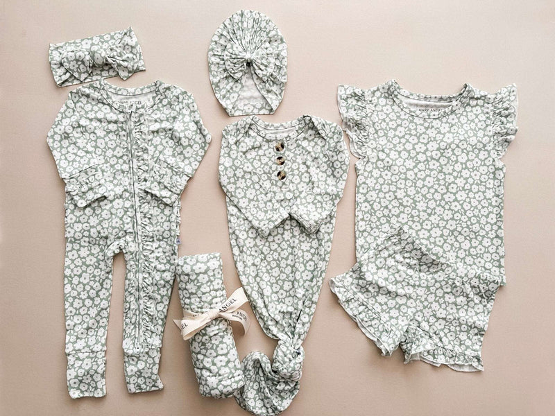 Two-piece short set in sage ditsy floral print with ruffle details, includes short sleeve top and shorts.