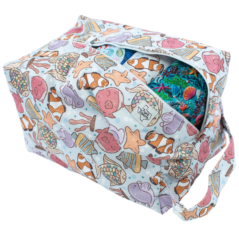 Under Waves Pod with vibrant ocean animal print and zipper closure.
