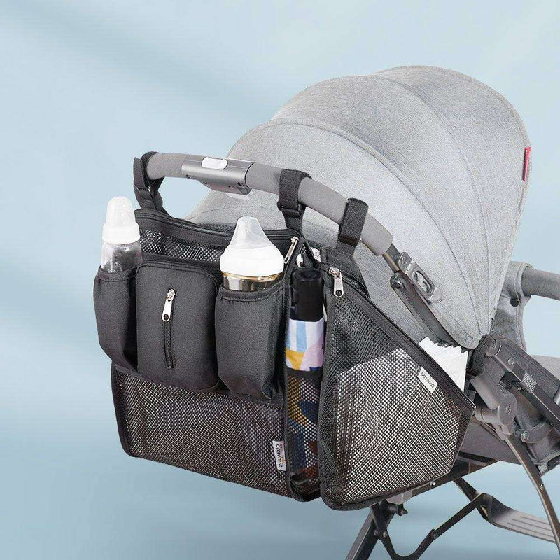 Universal stroller organizer with insulated cup holder, mesh storage, and multiple pockets attached to a stroller.