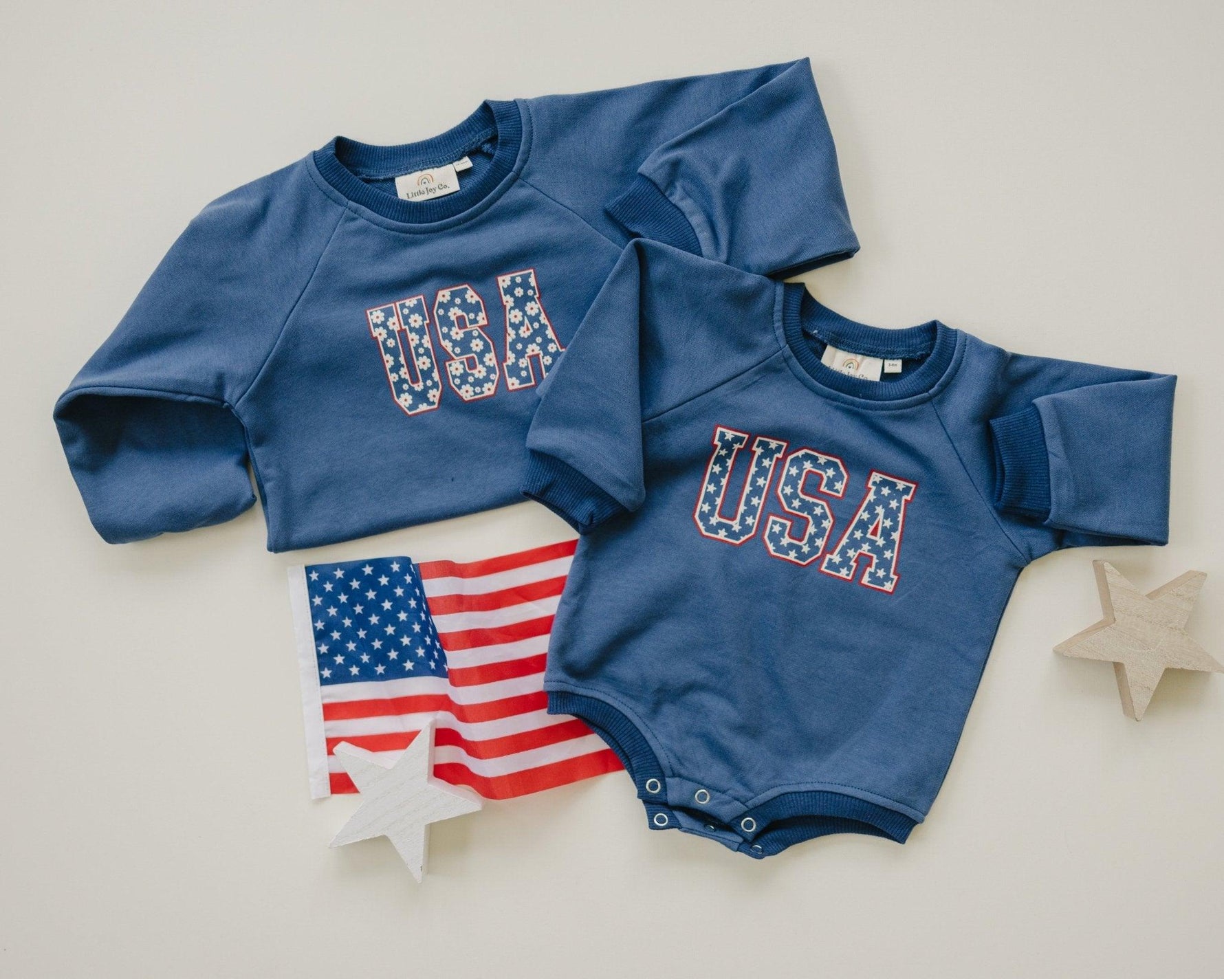 Little Joy Co. baby wearing a cozy, ultra-soft terry sweatshirt romper in a neutral color