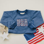 Little Joy Co. baby wearing a cozy, ultra-soft terry sweatshirt romper in a neutral color