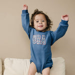 Little Joy Co. baby wearing a cozy, ultra-soft terry sweatshirt romper in a neutral color