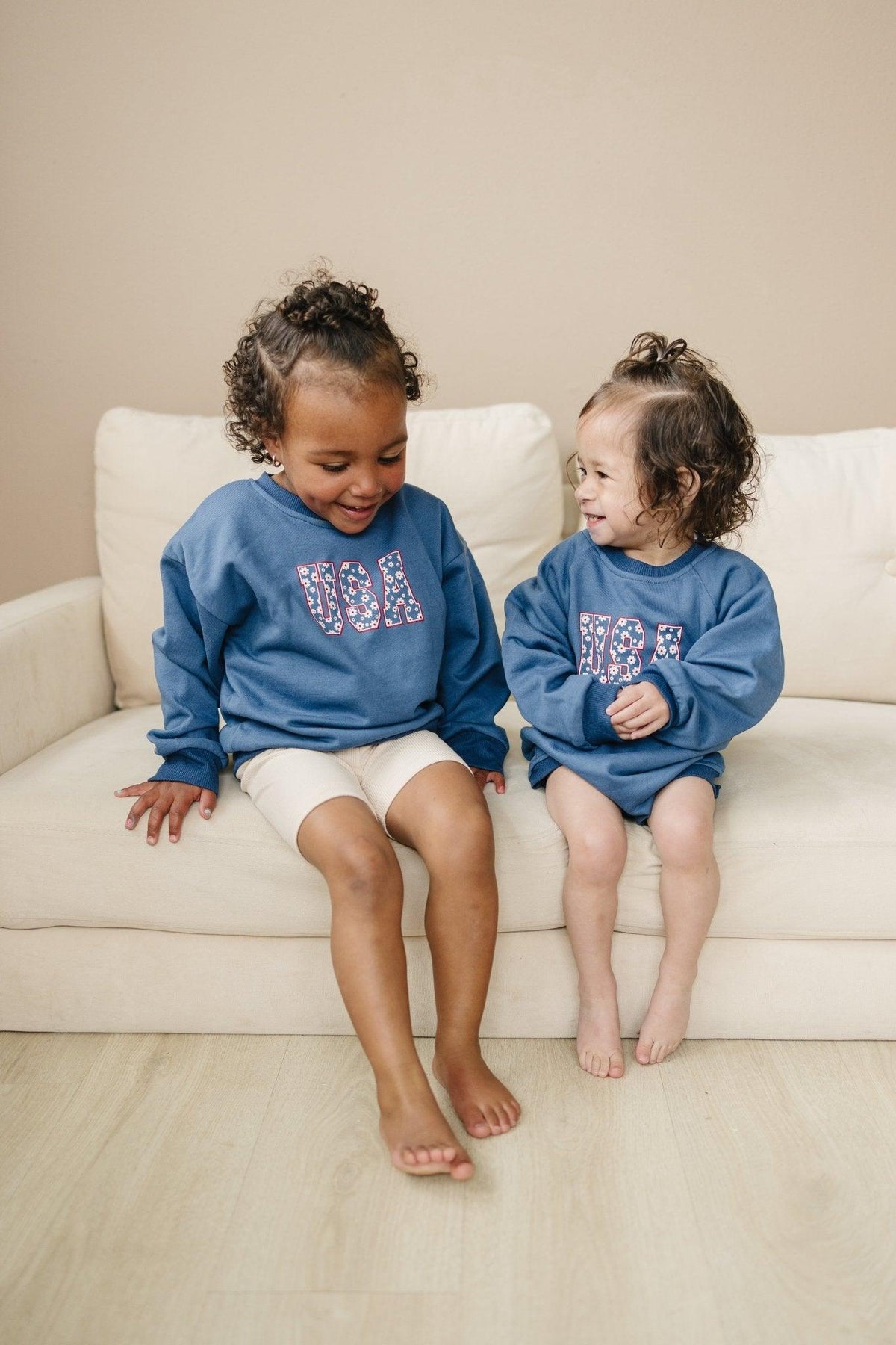 Little Joy Co. baby wearing a cozy, ultra-soft terry sweatshirt romper in a neutral color