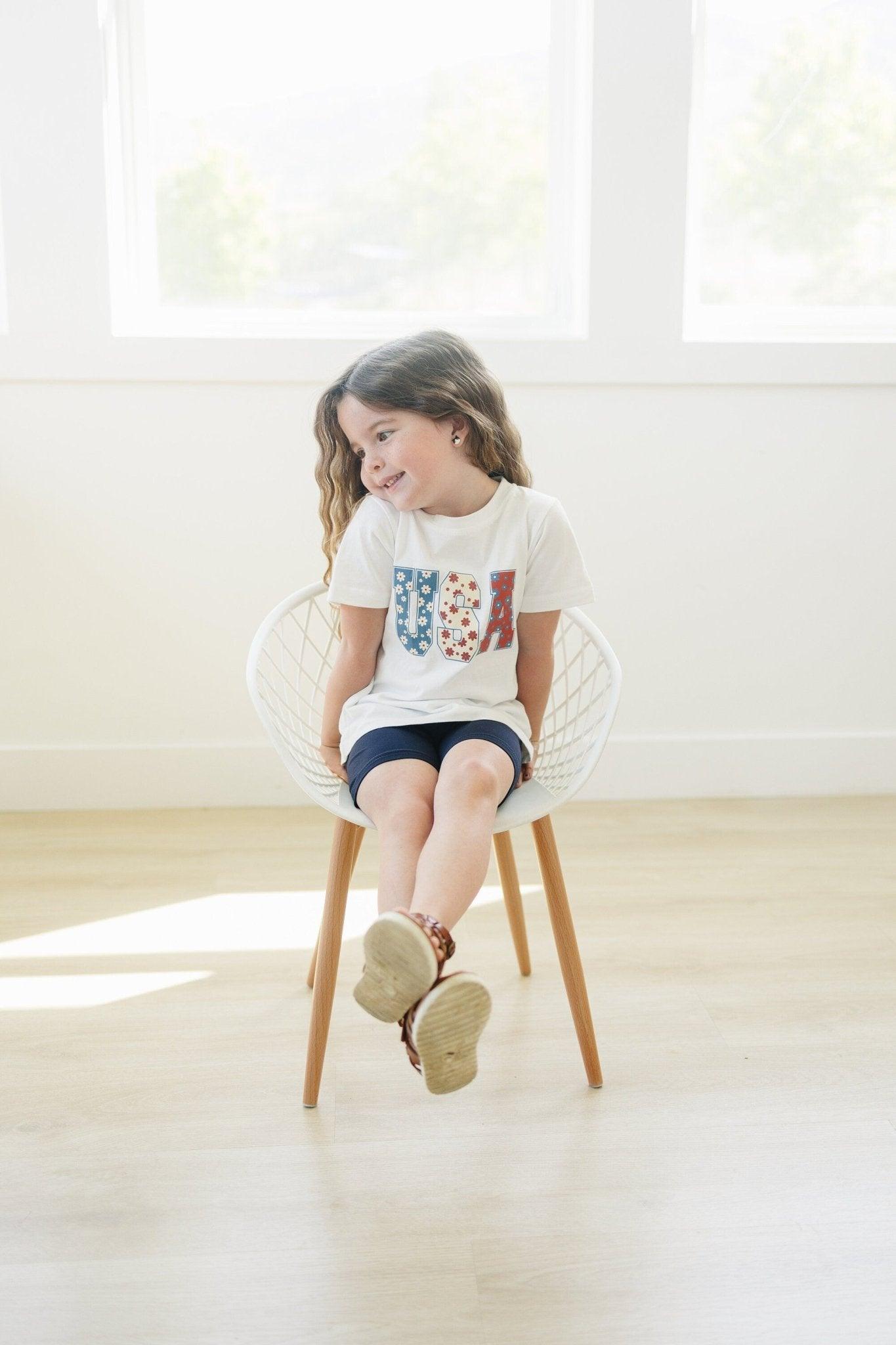 Little Joy Co. 100% organic cotton baby t-shirt in a neutral color, perfect for playtime.