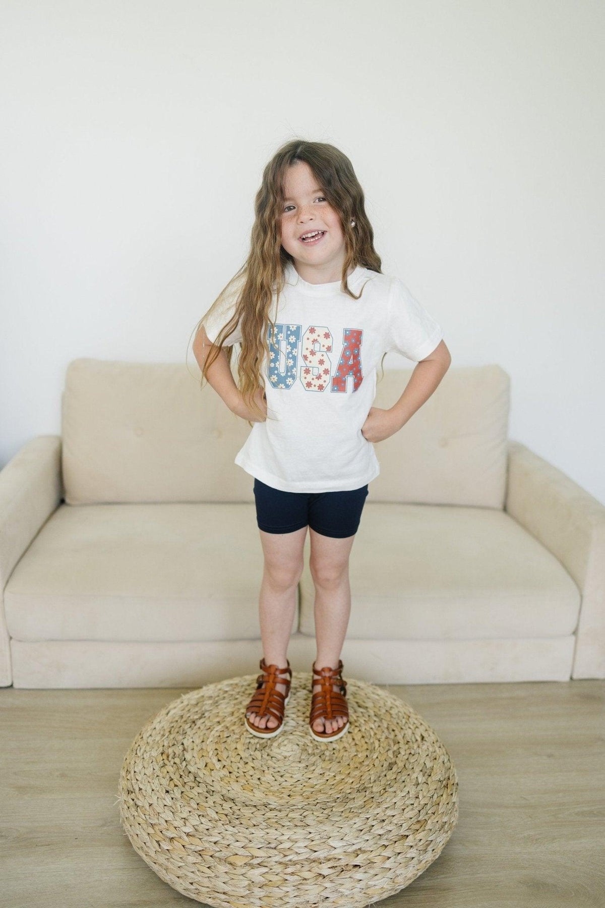 Little Joy Co. 100% organic cotton baby t-shirt in a neutral color, perfect for playtime.