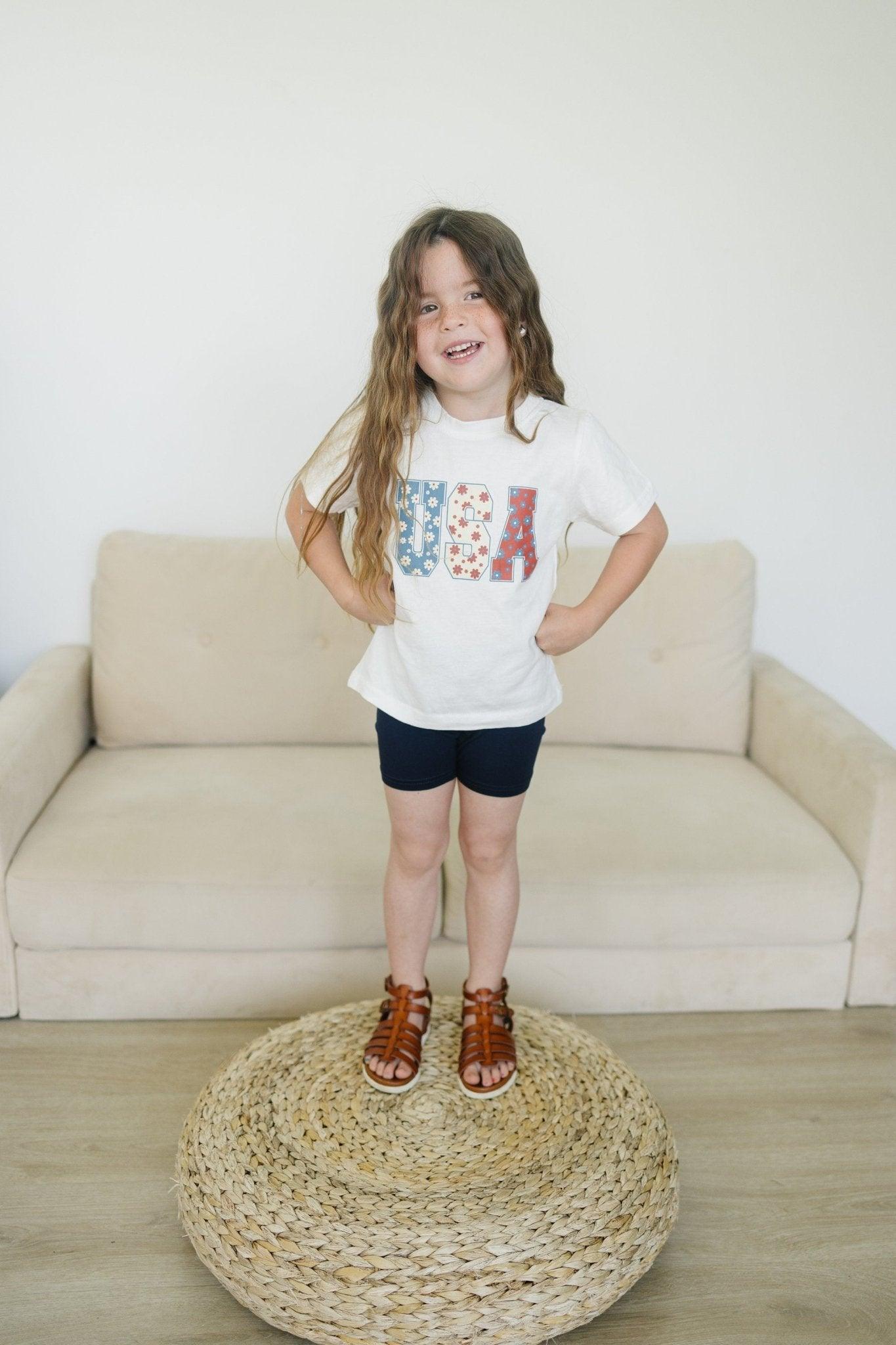 Little Joy Co. 100% organic cotton baby t-shirt in a neutral color, perfect for playtime.