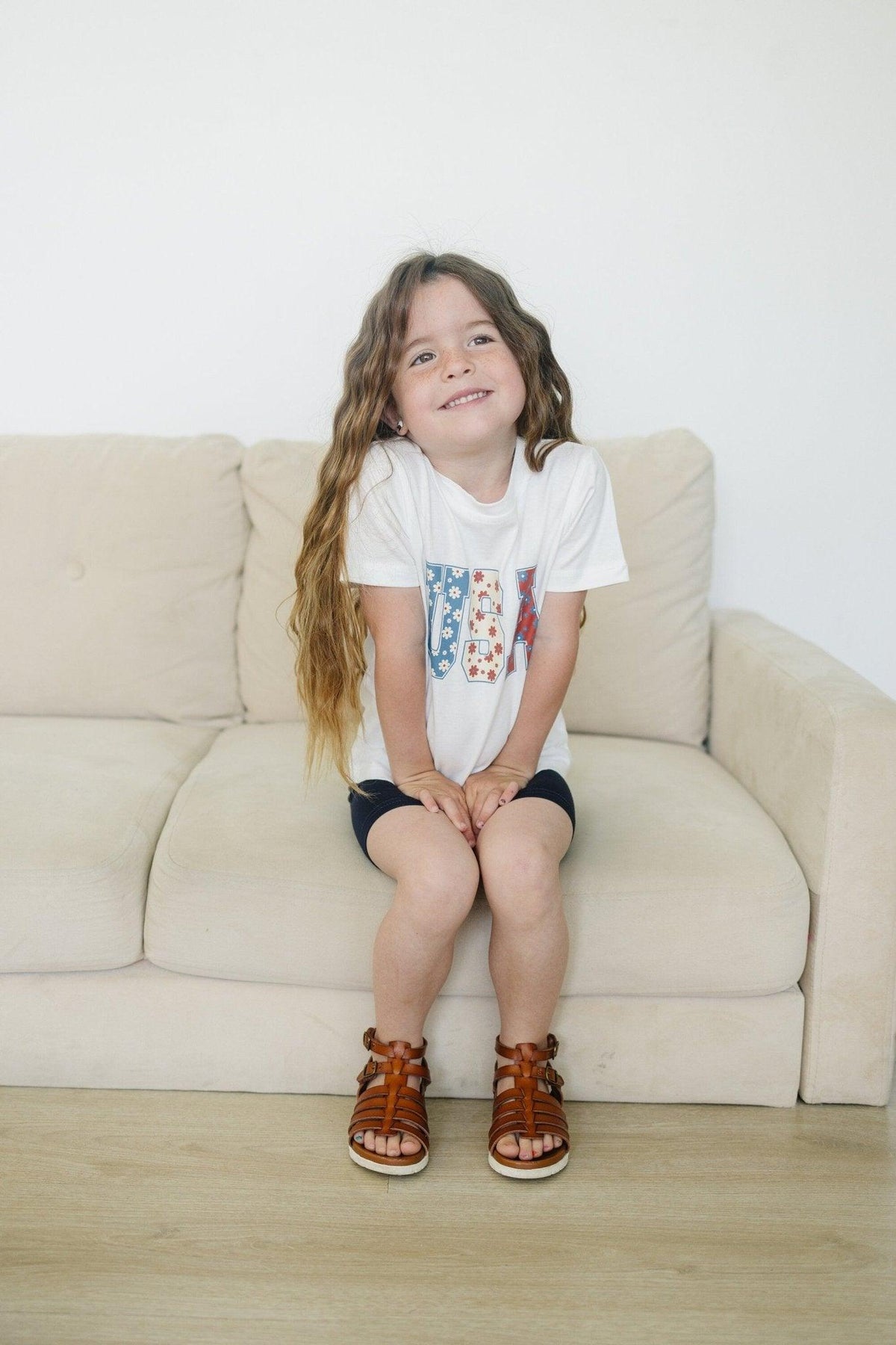 Little Joy Co. 100% organic cotton baby t-shirt in a neutral color, perfect for playtime.