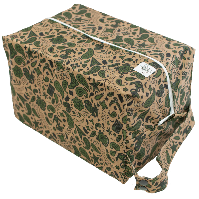 USA Pod diaper bag with green print, top zipper, and snap handle.