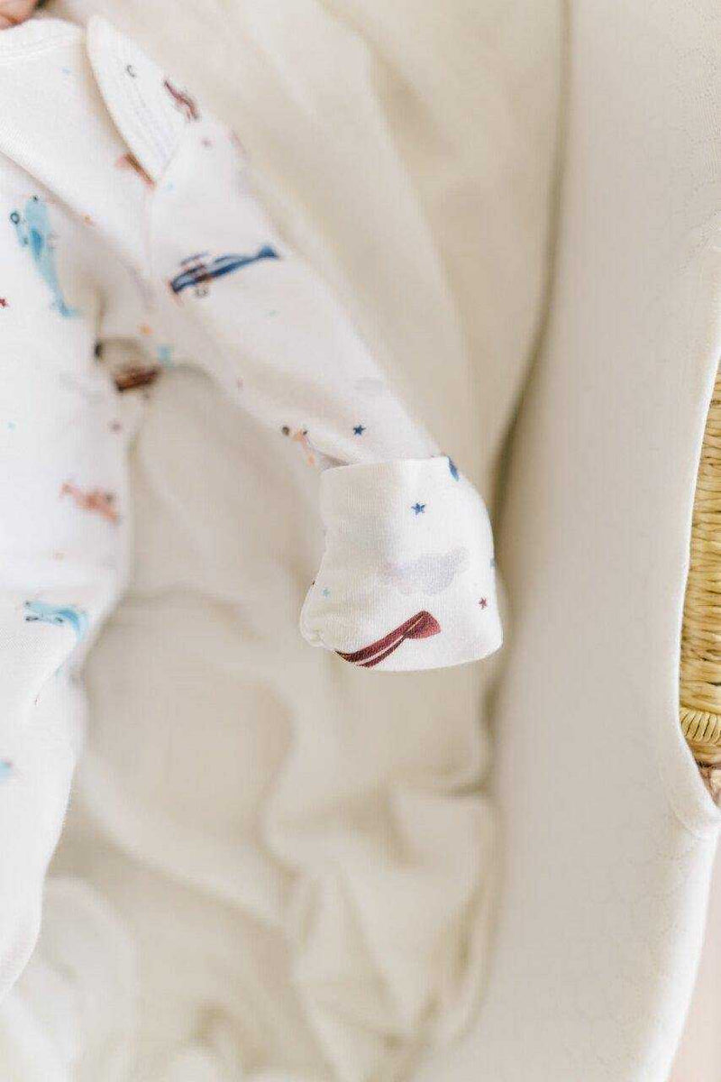 Knotted baby gown with vintage airplane design, made from soft bamboo viscose, shown with fold-over cuffs.