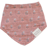 Muslin baby bib in a vintage pink floral print on a white background