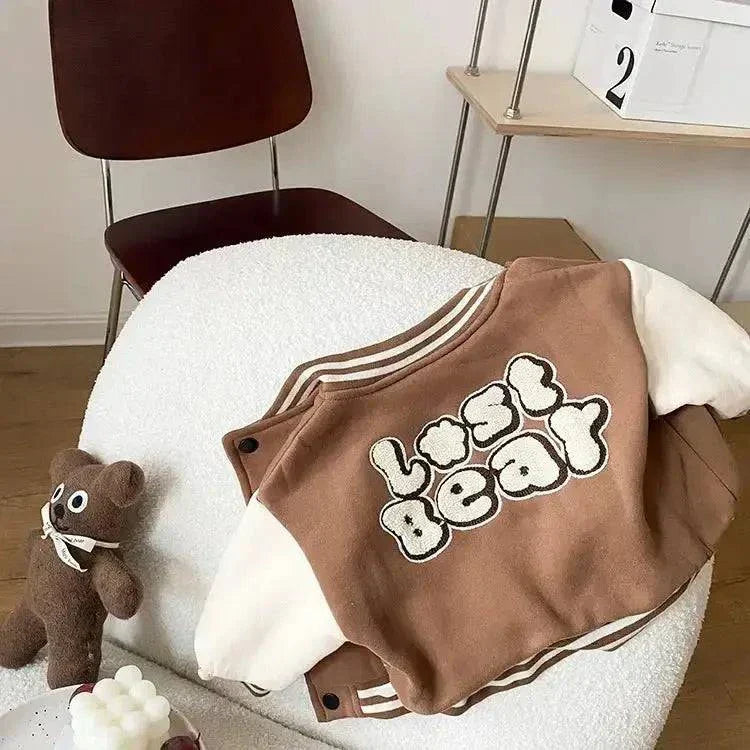 Cute toddler bear coat with plush design and brown and white color scheme, ideal for chilly weather.