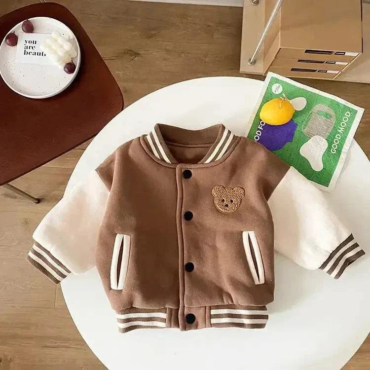 Cute toddler bear coat with soft texture and plush bear design, perfect for chilly weather.