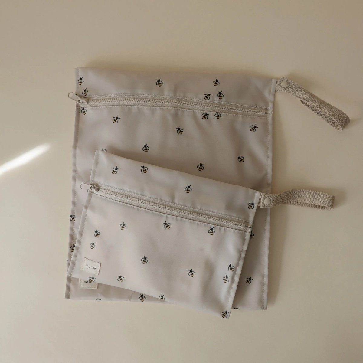 Mushie Water Resistant Wet Bag for Swimsuits and Dirty Clothes with Zipper Closure and Machine Washable Material -