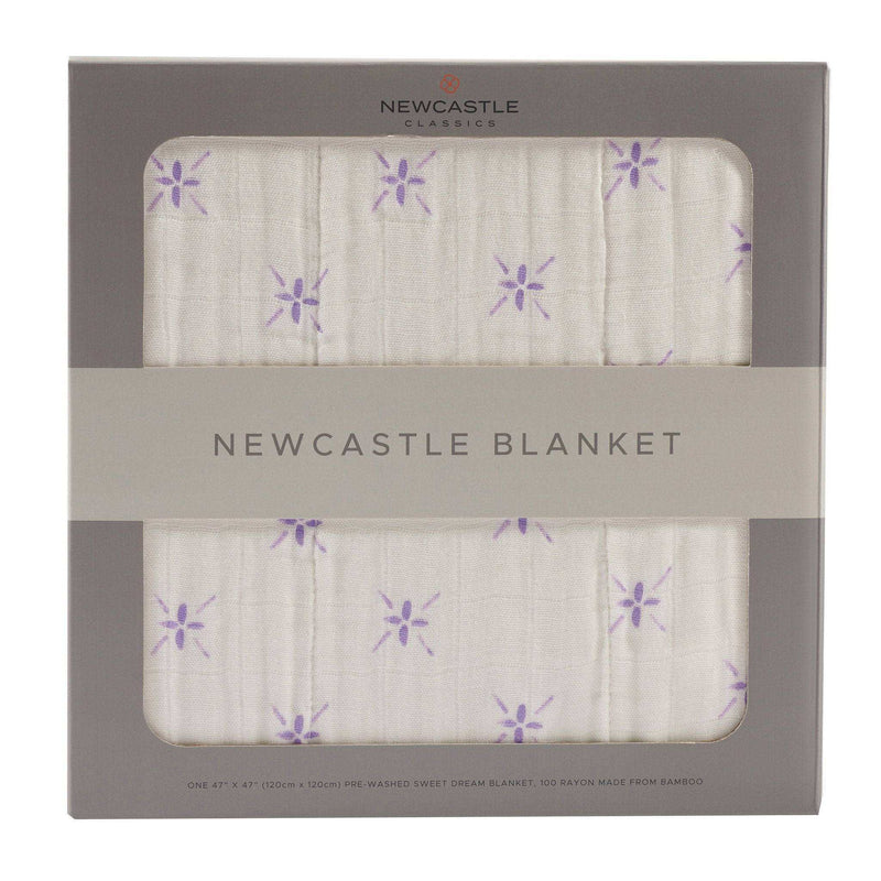 Watercolor Star and White Newcastle Blanket in packaging, featuring soft, breathable cotton and bamboo muslin layers.